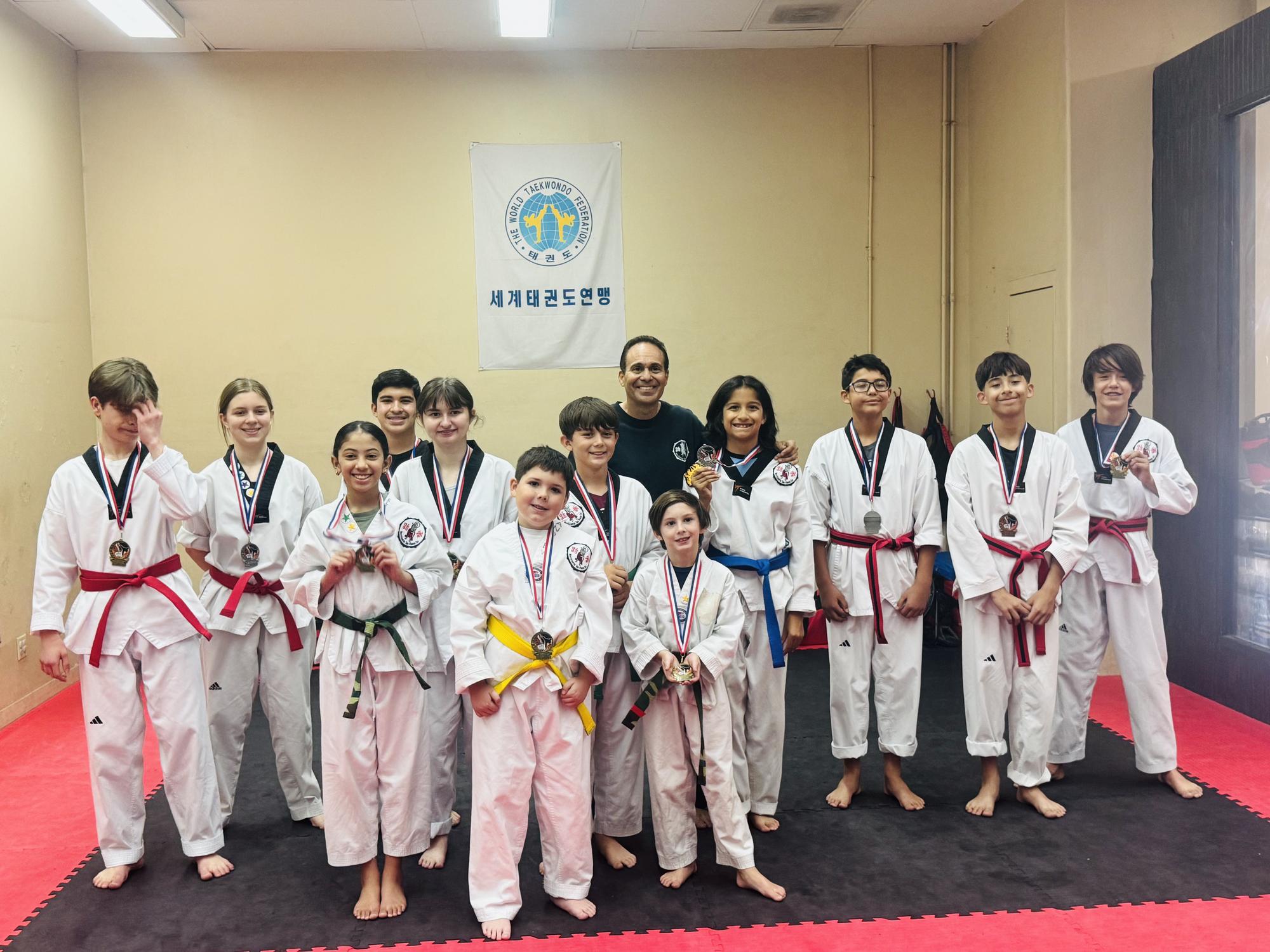 Master Erik Morrissette and students celebrating tournament wins at Morrissette Martial Arts